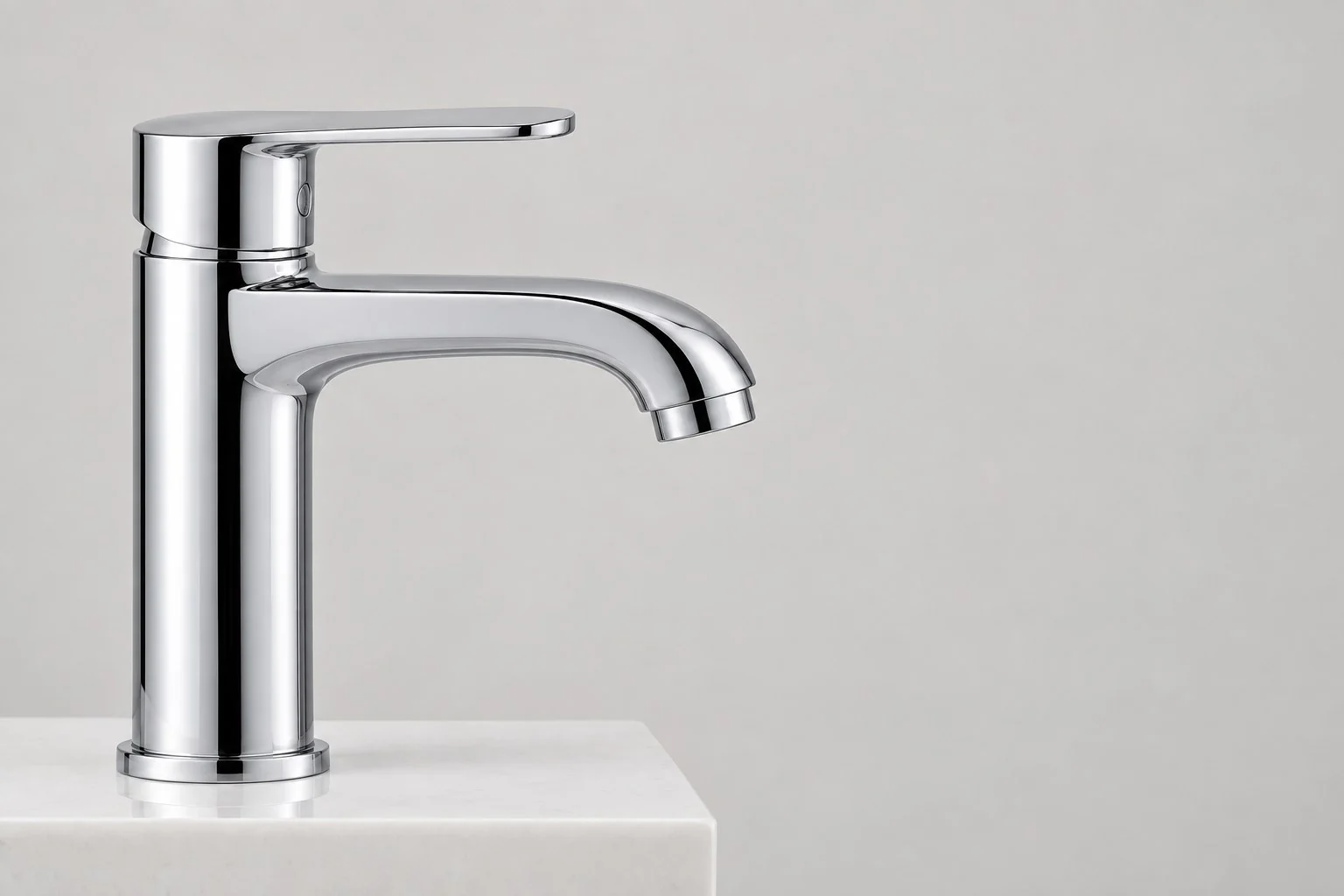 Chrome single-lever basin faucet on a white countertop, without annotations