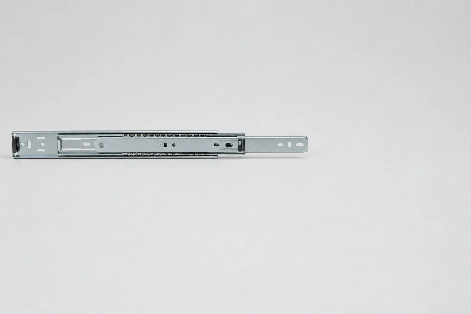 Zinc-plated three-section ball-bearing drawer slide, partly extended, without annotations