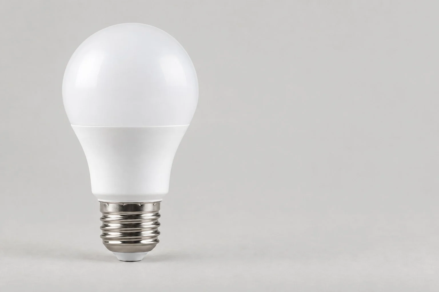 White frosted LED bulb with an E27 screw base, without annotations